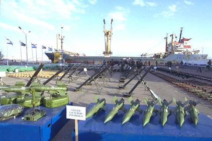 Missiles, mortar launchers and other weapons found on Karin A ship in the background in Eilat port