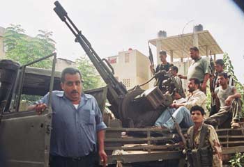 Suburban warfare: Hezbollah fighters are ready for action in a residential area.